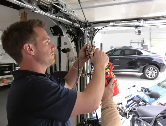 Broadview Heights Garage Door Repair safety certified technician performing cable replacement in Broadview Heights